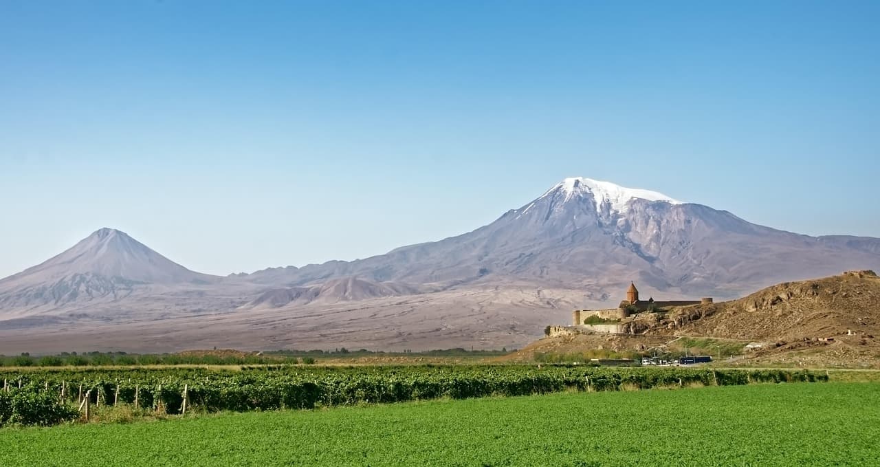 Khor Virap monastery below Mount Ararat, with vineyards in front, Armenia