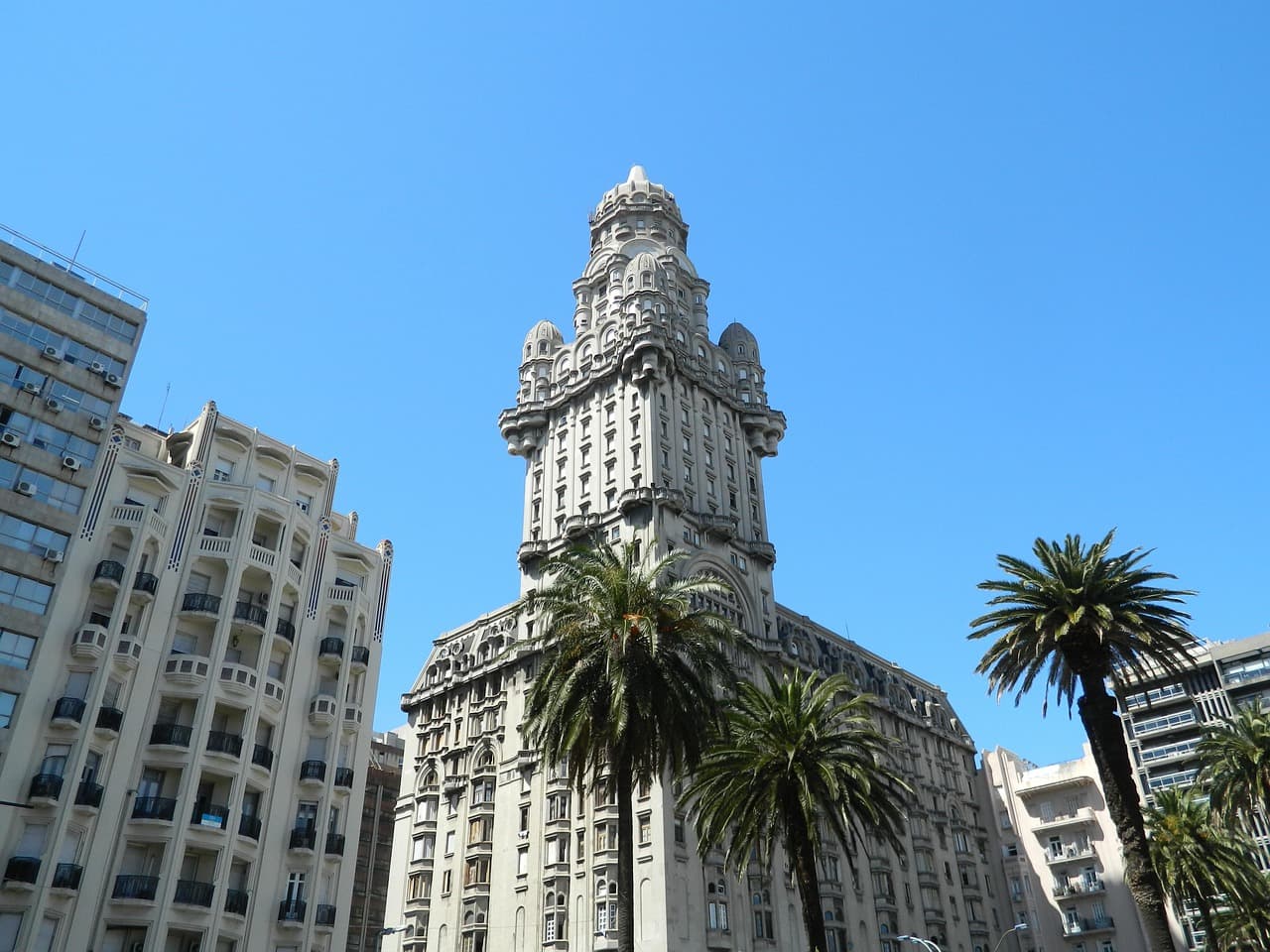 Palacio Salvo and palm trees on Plaza Independencia, Montevideo
