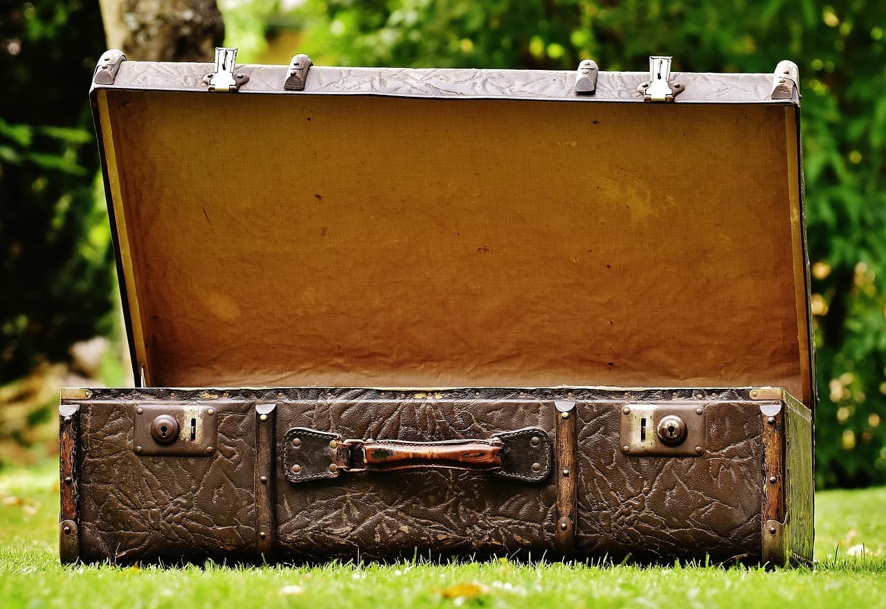 An open, old leather suitcase